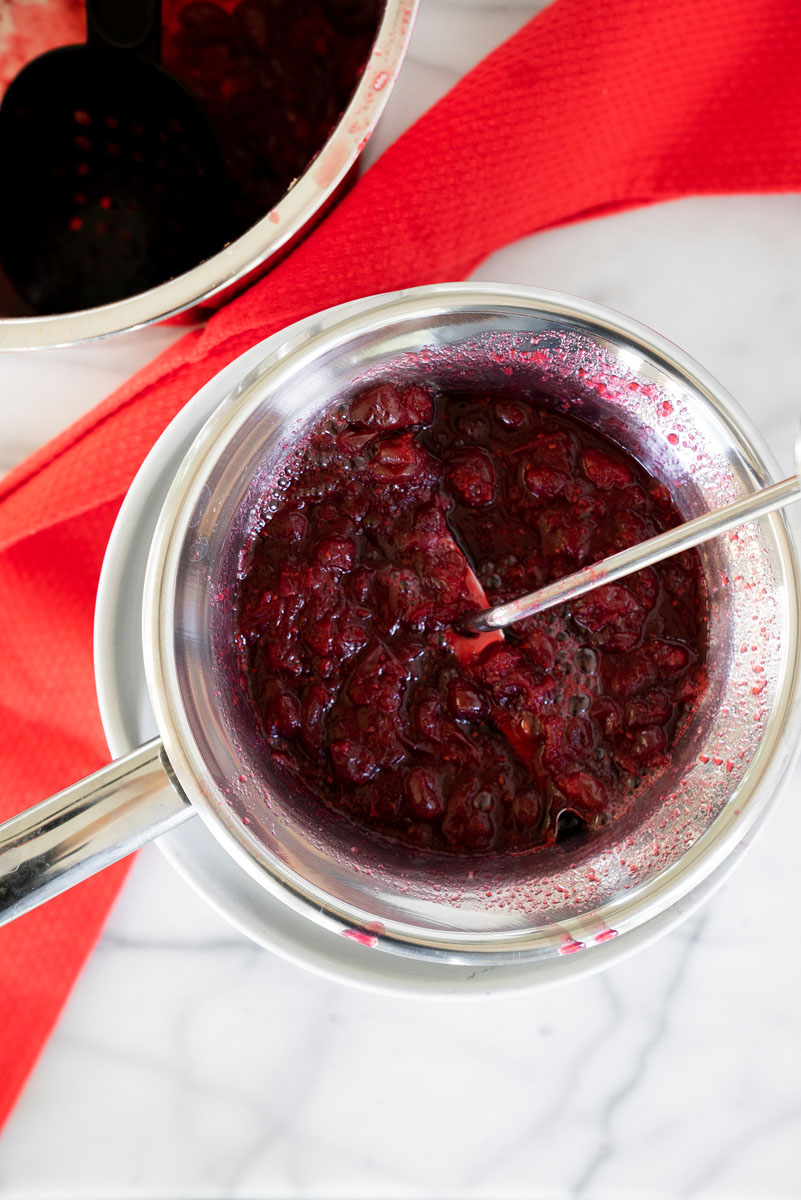 running cranberries through a food mill