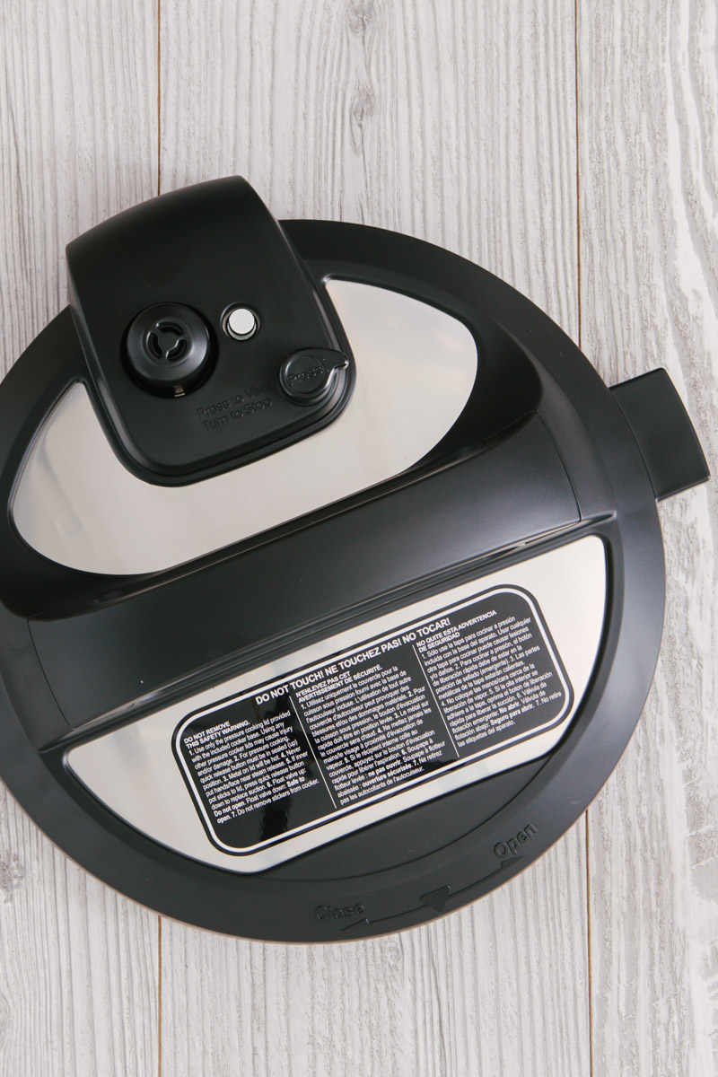 overhead shot of the lid of the Instant Pot Duo Gourmet on a gray wood background.