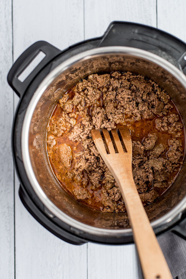 Overhead shot of ground beef cooked in an Instant Pot with all the spices.