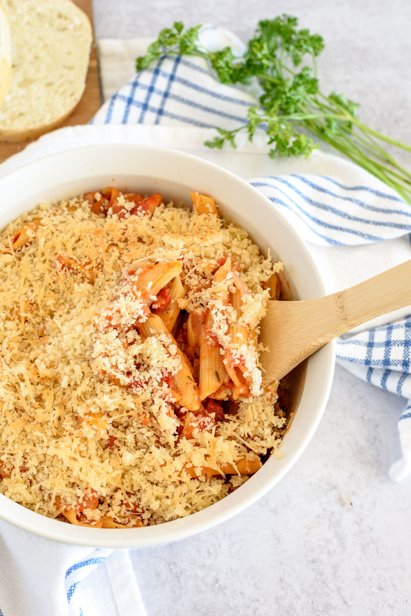 Overhead picture of Instant Pot eggplant parmigiana in a ramekin, topped with panko and ready to serve.