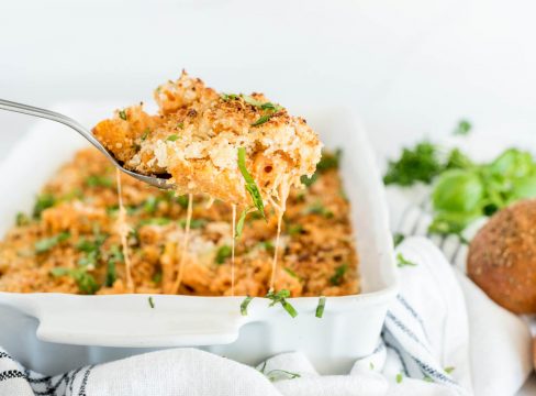 Close-up shot of a spoonful of Five Cheese Ziti, made in an Instant Pot and topped with breadcrumbs and cheese and parsley.