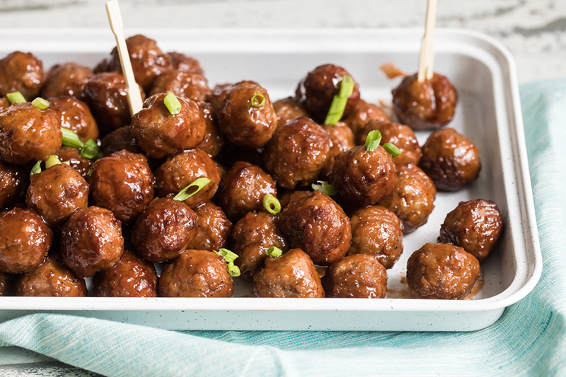 InstaPot grape jelly bbq meat balls on a platter and ready to serve for a party.