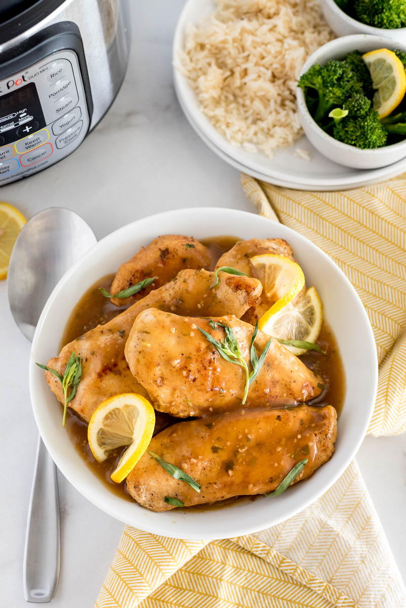 lemon tarragon chicken breasts in front of an instant pot