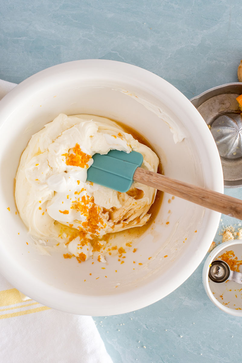 mixing the filling for lemon cheesecake