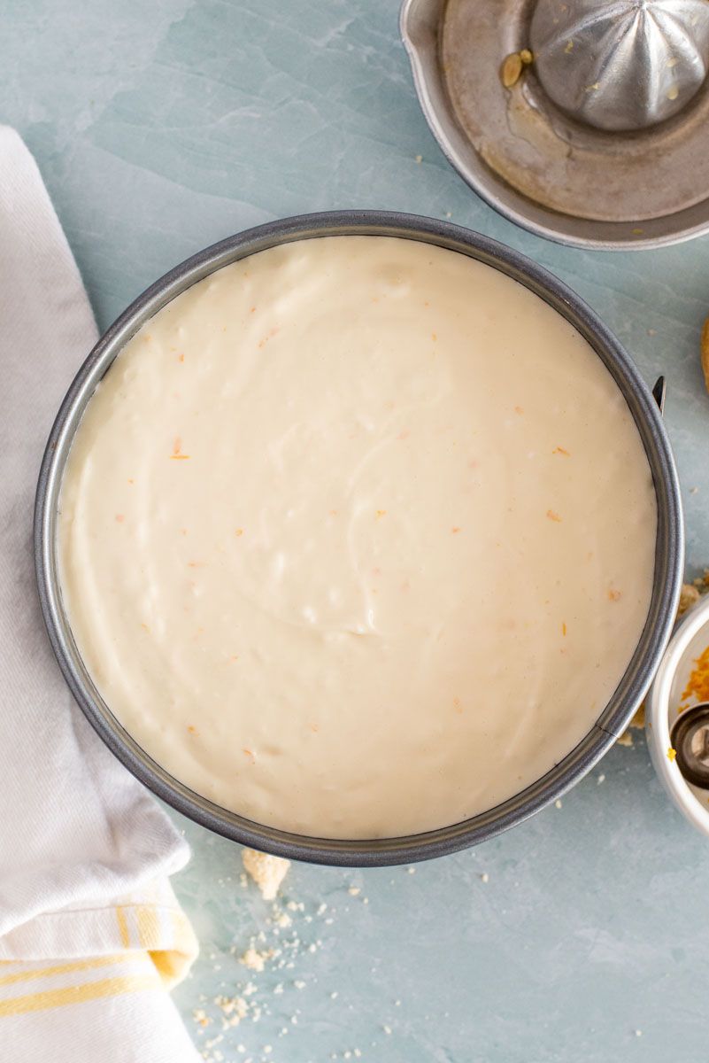 assembled lemon cheesecake in a springform pan