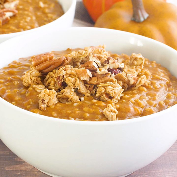 Pumpkin Spice Instant Pot Steel Cut Oats in a white bowl, topped with pecans and granola