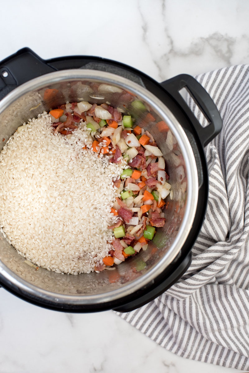 Ingredients added to an Instant Pot for making Risotto Bolognese.