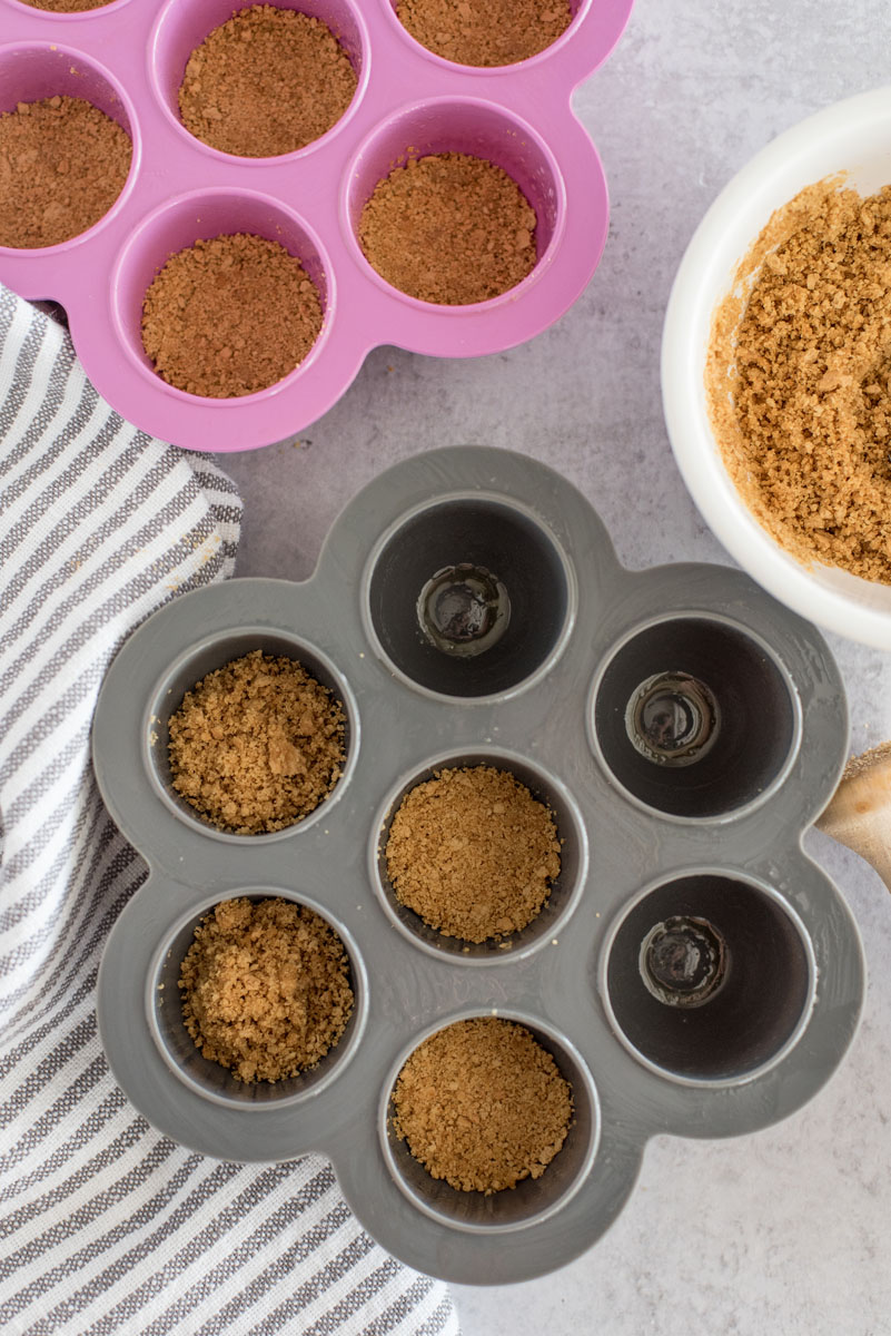 filled egg bite mold with graham cracker crust