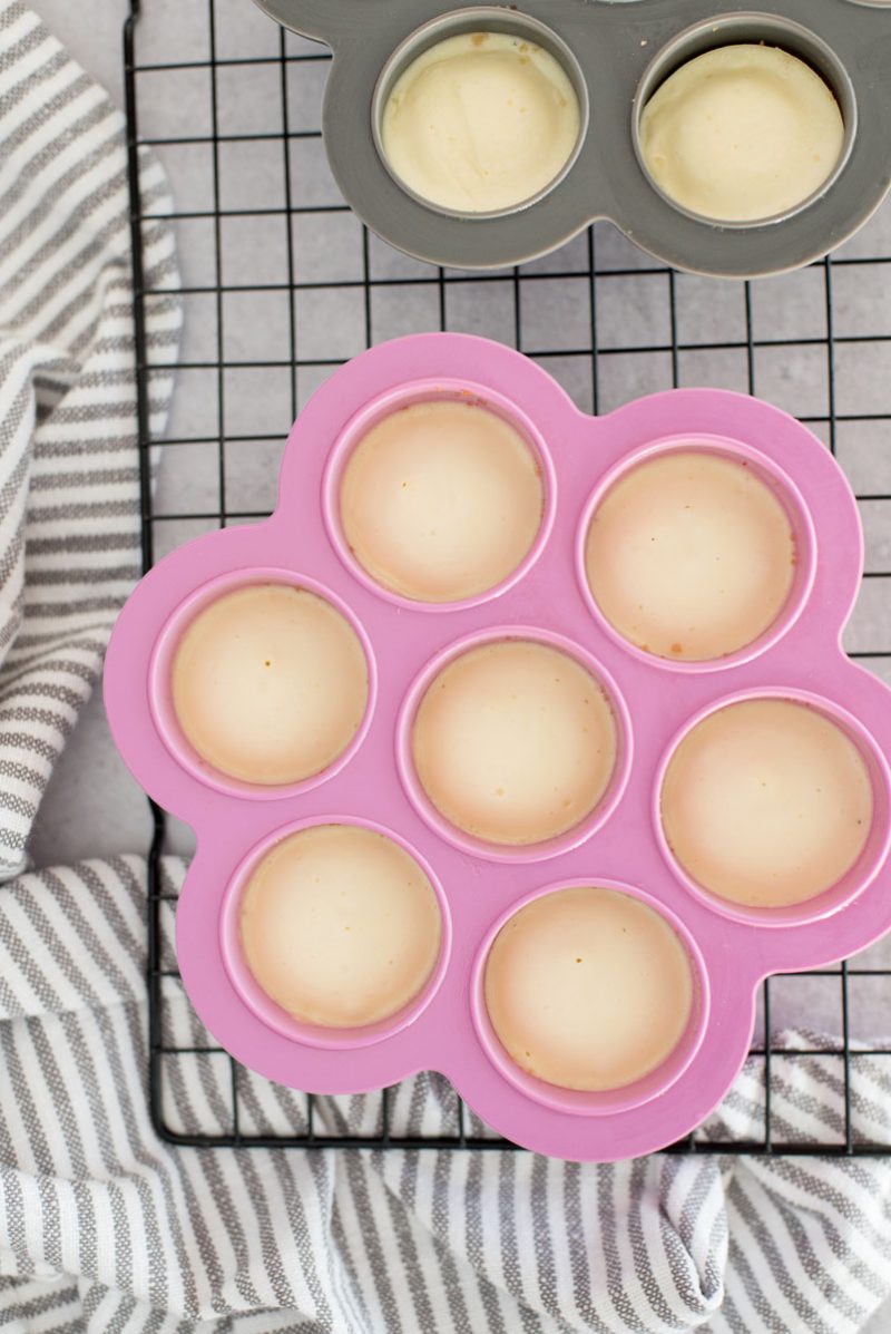 cooked InstaPot mini cheesecake bites in a pink silicone egg-shaped mold