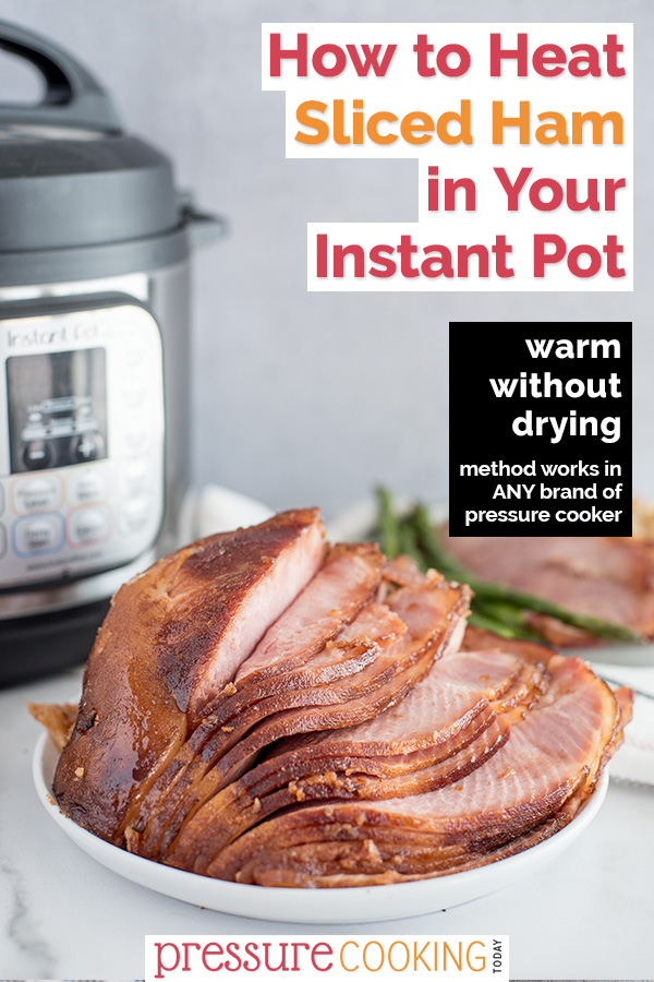 A spiral cut ham on a platter placed in front of an Instant Pot.