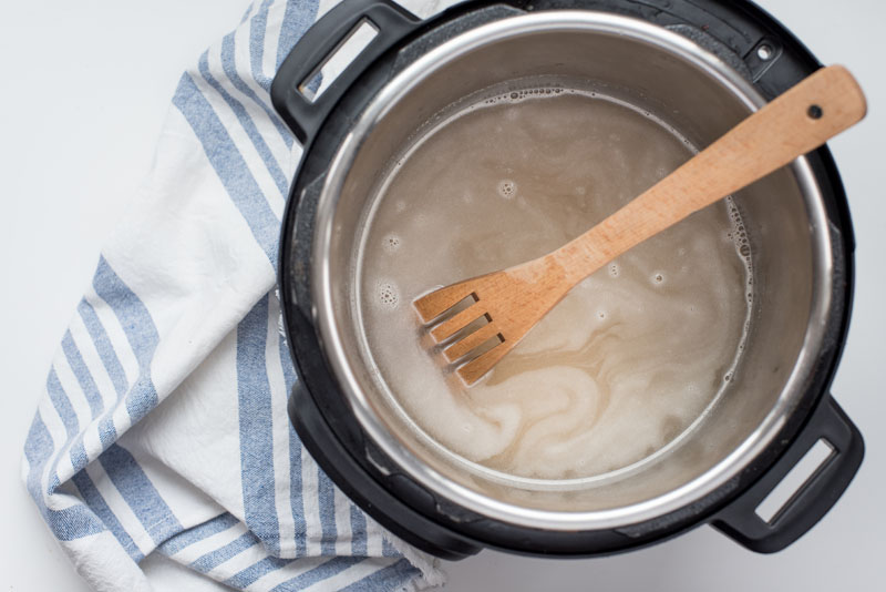 Instant pot with steel cut oats cooking in water