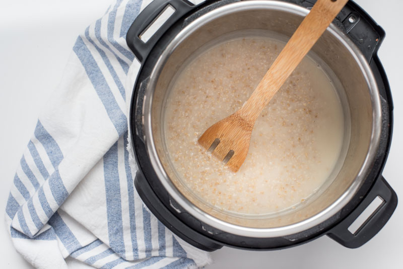 creamy pressure cooker steel cut oats cooking inside an instant pot