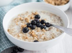 pressure cooker oatmeal with blueberries in a white cereal bowl