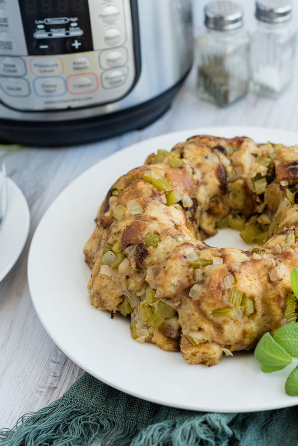 Pressure Cooker stuffing with an Instant Pot and salt and pepper in the background