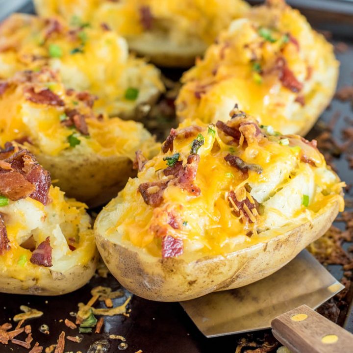 twice baked ranch poatoes on a baking sheet with a spatula under