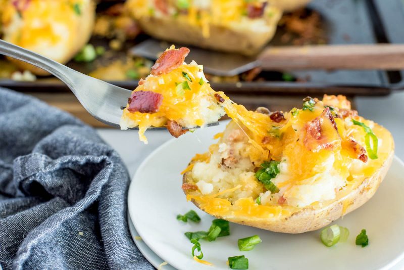 ranch baked potato with a bite being taken out by a fork