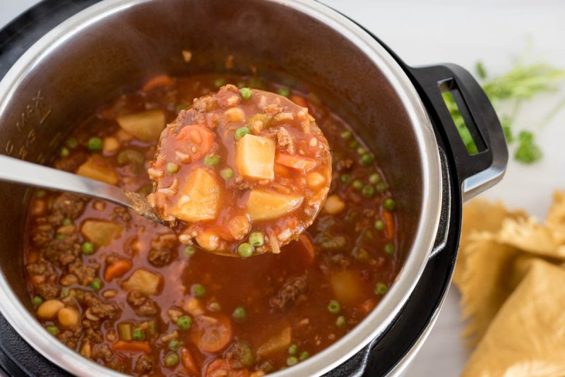 Pressure cooker vegetable beef and rice soup cooked and ready to serve from an Instapot.