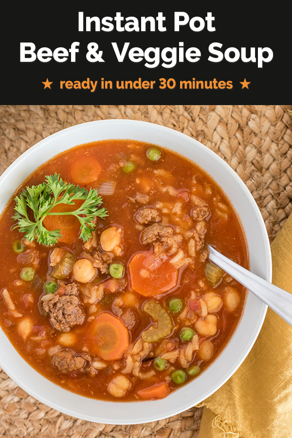 Close up picture of Instant Pot Beef and Vegetable soup garnished with a fresh sprig of parsley and served in a white bowl on a woven mat. via @PressureCook2da