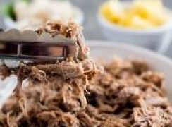 Instant Pot / Pressure Cooker Kalua Pork recipe, plated and ready to serve with pineapple and white rice