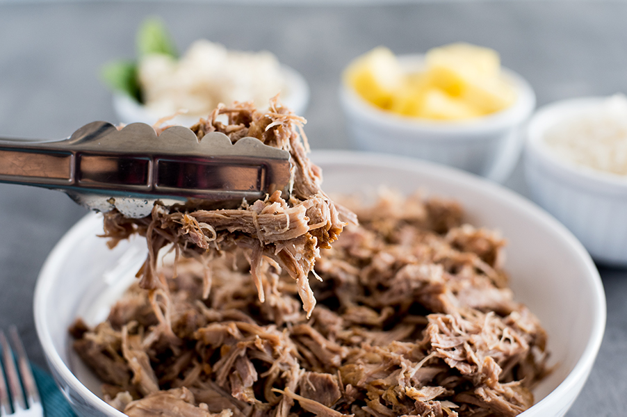 Instant Pot / Pressure Cooker Kalua Pork recipe, plated and ready to serve with pineapple and white rice