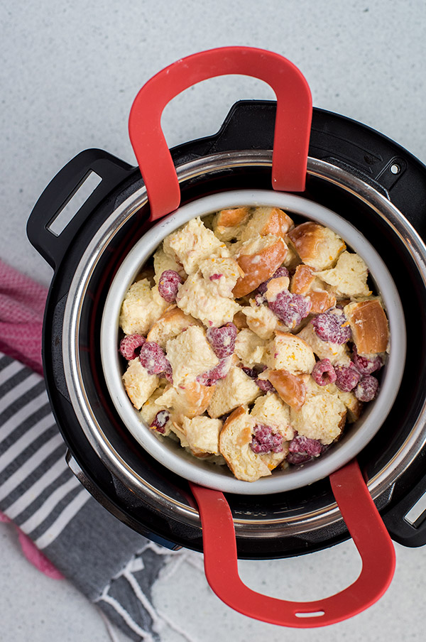 Raspberry Bread Pudding cooked in the Instant Pot with slings inserted to remove when done.