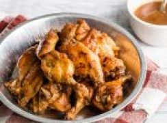 Instant Pot / pressure cooker teriyaki chicken wings placed in a tin and ready to serve.