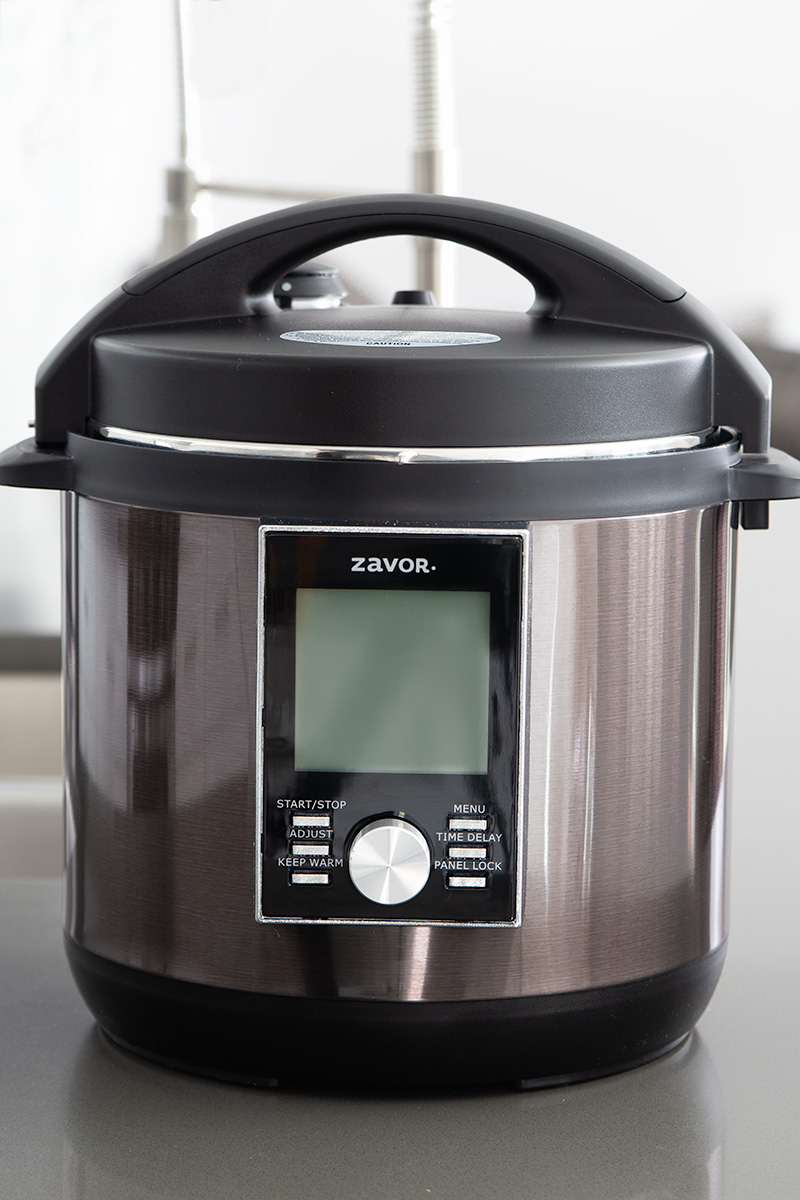 Black stainless steel Zavor LUX placed on a kicken counter.