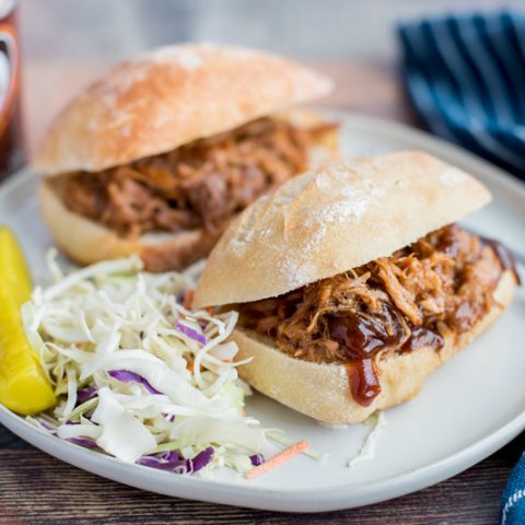 Instant Pot / Pressure Cooker Root Beer Pulled Pork sandwiches plated and ready to serve