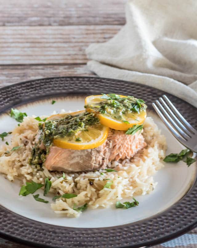 A plate of food with broccoli, with Salmon and Rice