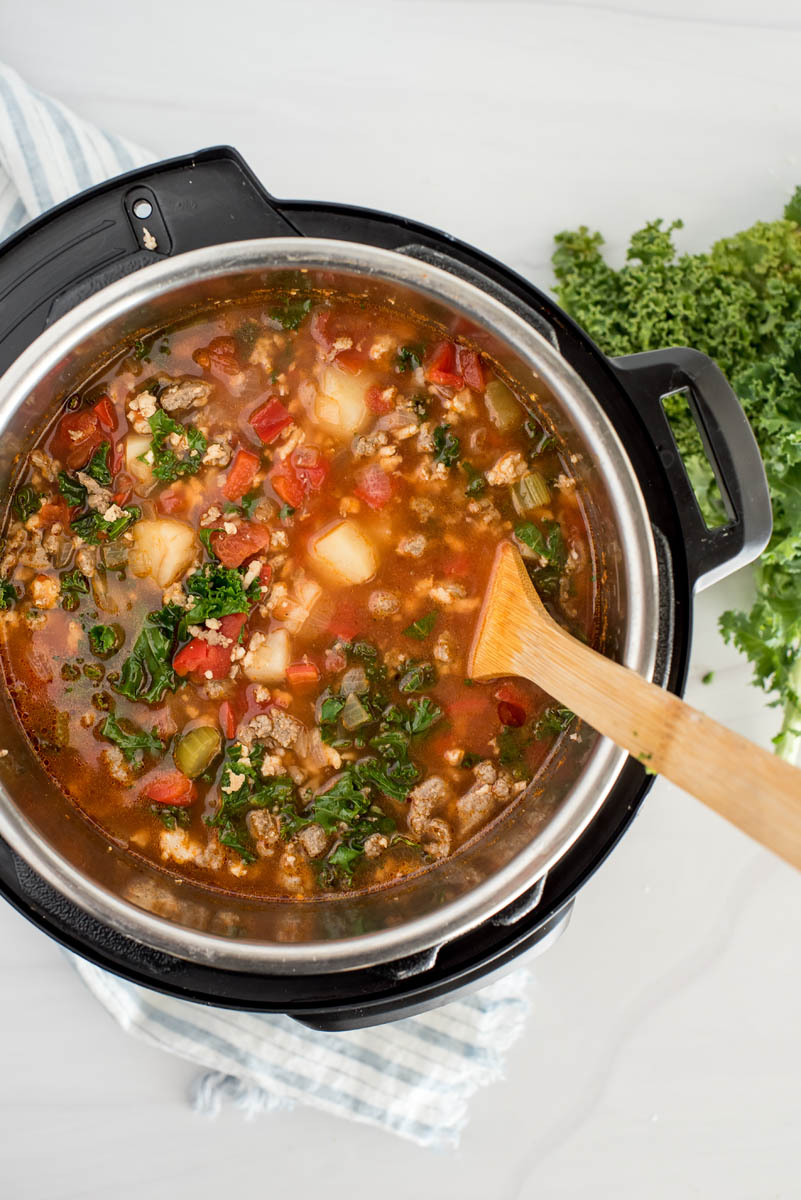 instant pot with sausage soup and tomato broth