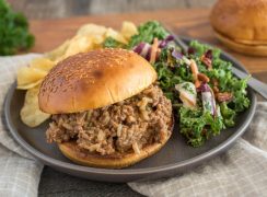 Quick sloppy joes made with frozen beef, served on a bun with salad and potato chips.