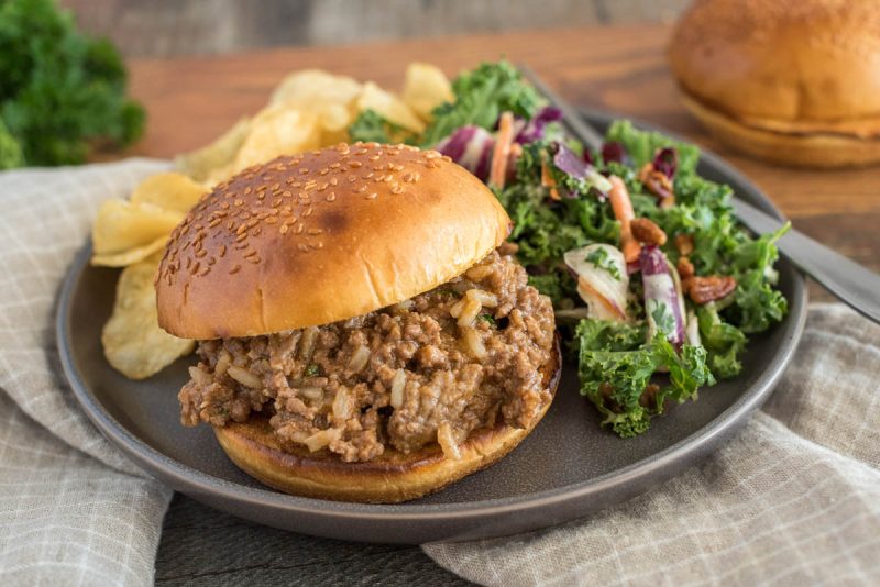 Quick sloppy joes made with frozen beef, served on a bun with salad and potato chips.