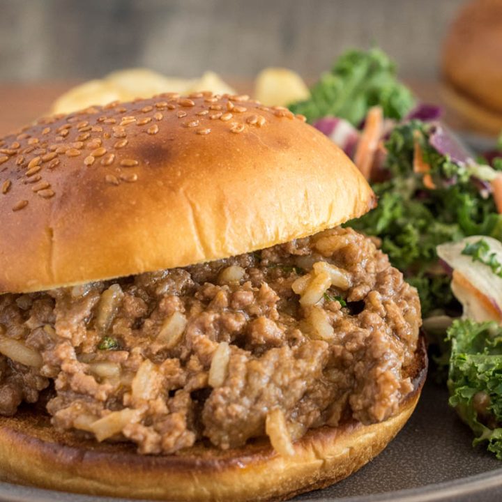 Quick sloppy joes made with frozen beef, served on a bun with salad and potato chips.