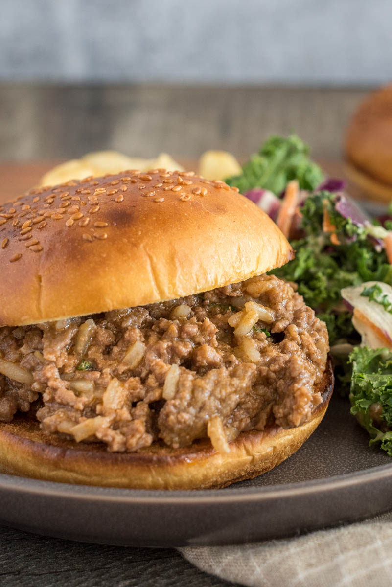 Quick sloppy joes made with frozen beef, served on a bun with salad and potato chips.