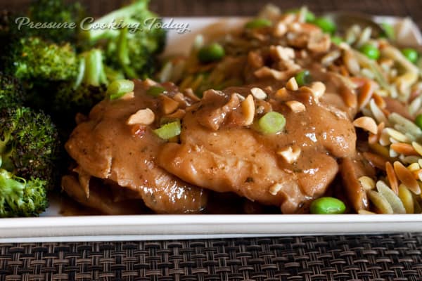 Pressure Cooker Thai Chicken Thighs served on a white plate