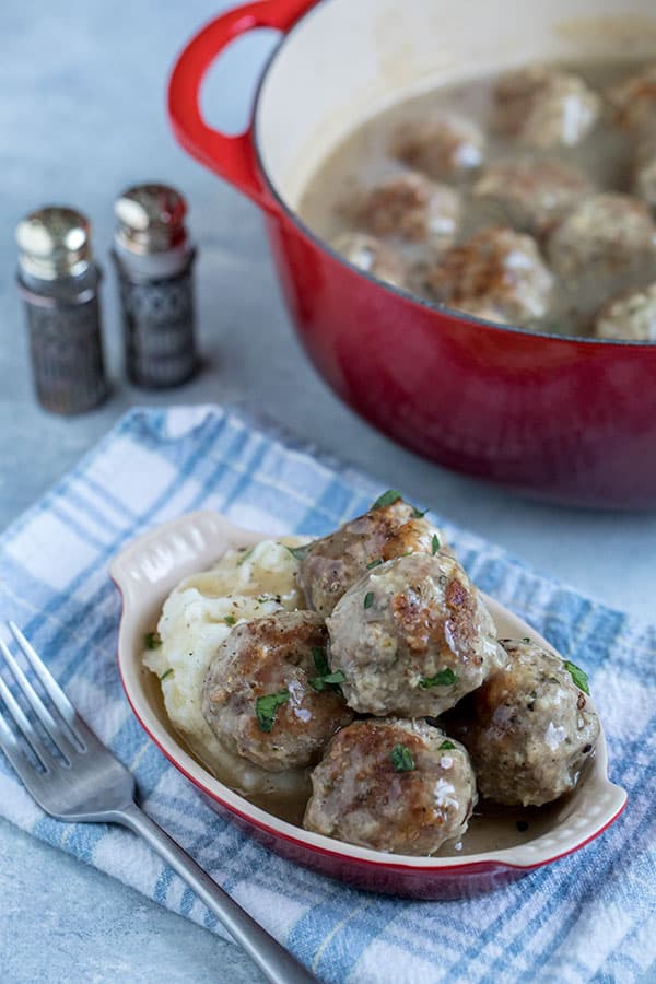 These Pressure Cooker Turkey Meatballs served over mashed potatoes with gravy have all the flavors of a big turkey dinner.